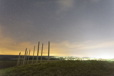 Scenic view of field against sky at night