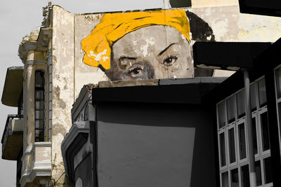 Low angle view of statue against building