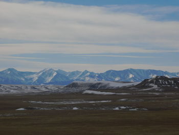 Scenic view of snowcapped mountains against sky