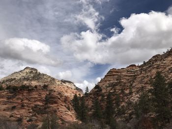 Low angle view of rock formations against sky