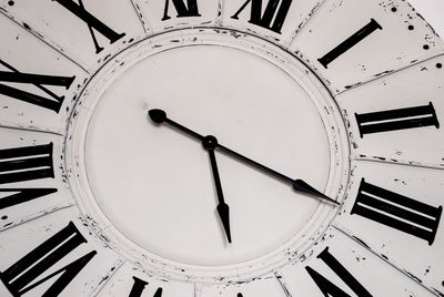 Low angle view of clock on ceiling