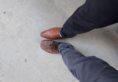 Low section of man standing on floor