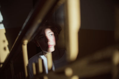 Young man looking away at steps