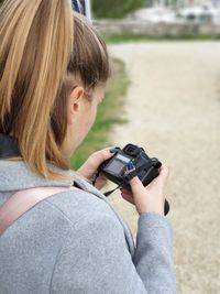 Portrait of woman photographing