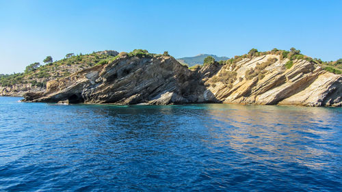 Scenic view of sea against clear blue sky