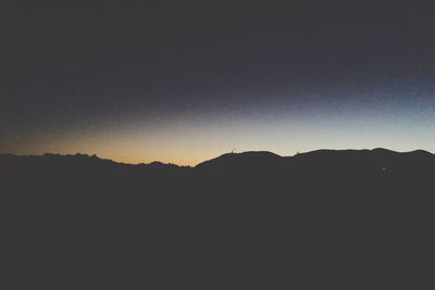 Scenic view of mountains at sunset