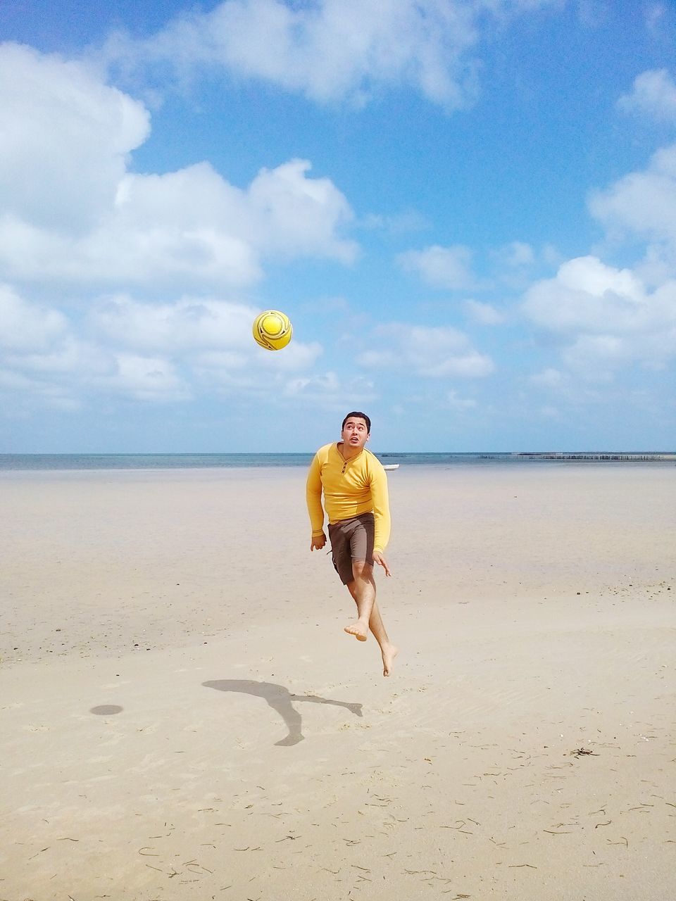 beach, full length, sand, sea, sky, shore, horizon over water, lifestyles, leisure activity, rear view, water, casual clothing, vacations, walking, childhood, tranquil scene, cloud - sky, person