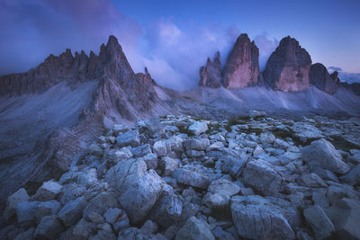 Rock formations on landscape against sky