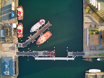 High angle view of boats moored at harbor