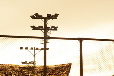 Low angle view of weather vane against clear sky