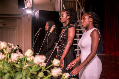 Choir singing on microphones at church