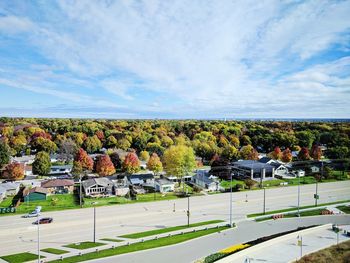 Multi colored town against cloudy sky