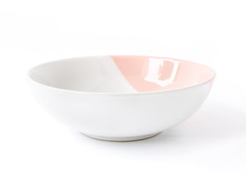 Close-up of bowl over white background