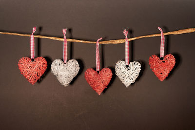 Close-up of heart shape decoration against black background