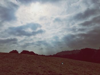 View of landscape against cloudy sky