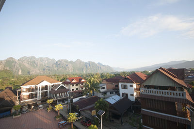 High angle view of houses and buildings against sky