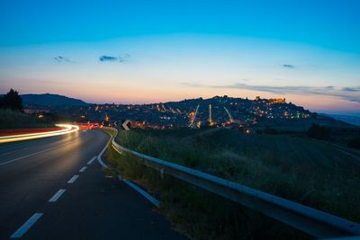 High angle view of light trails on road in city