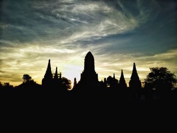 Silhouette of temple against sky during sunset