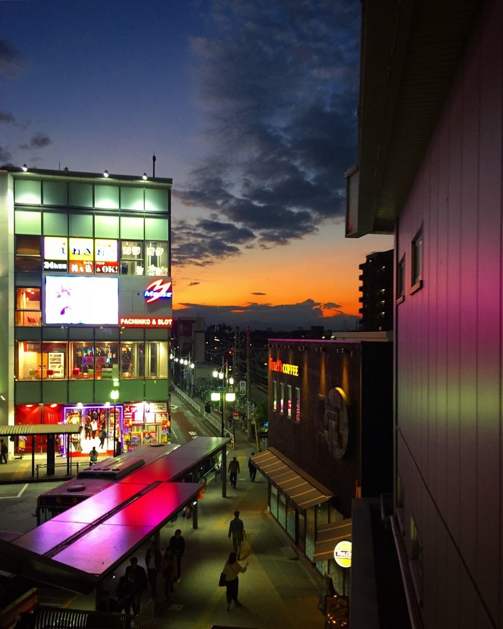 PEOPLE ON STREET AT NIGHT