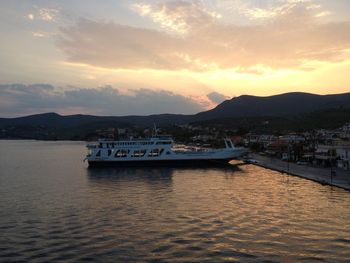 Boat in sea at sunset