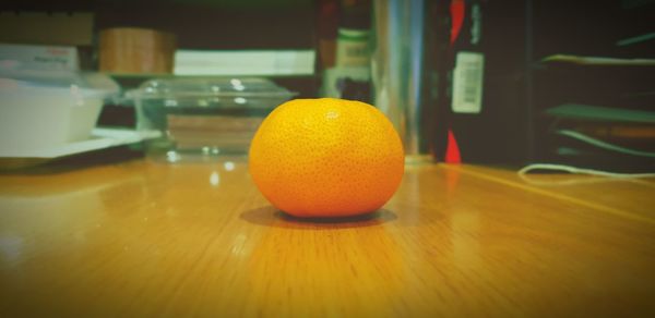 Close-up of orange on table at home