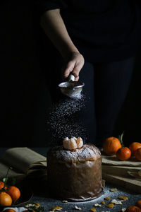 Midsection of man preparing food on table