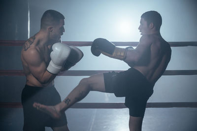 Fighters fighting in ring