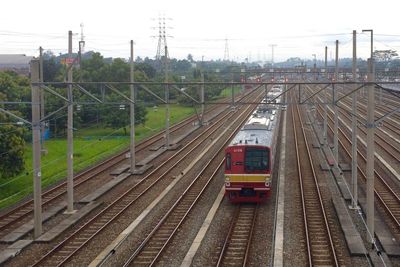 Train at railroad station against clear sky