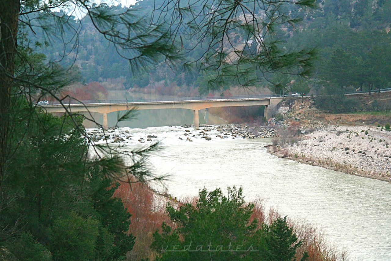 VIEW OF DAM ON RIVERBANK