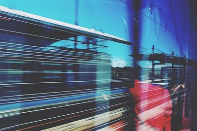 Blurred motion of train at railroad station