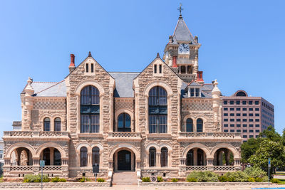 Low angle view of building against clear blue sky