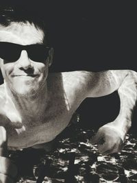 Close-up portrait of man wearing sunglasses