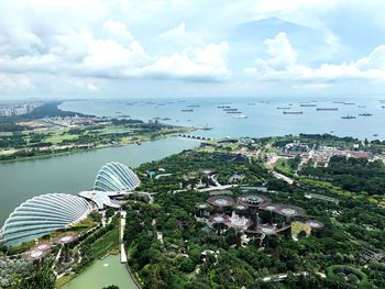 High angle view of buildings and trees against sky