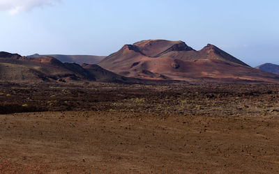 Scenic view of volcanic landscape against sky