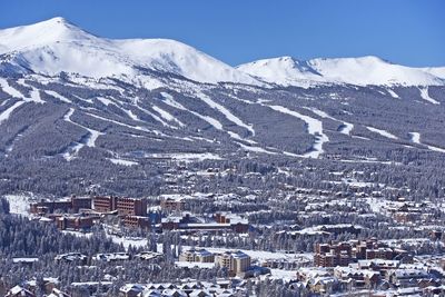 Aerial view of townscape and snowcapped mountains