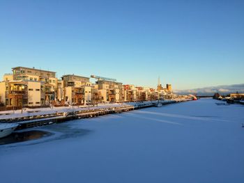 City against clear blue sky during winter