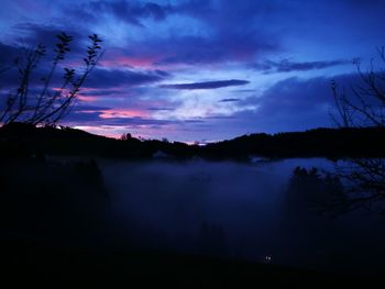 Scenic view of silhouette landscape against sky at sunset