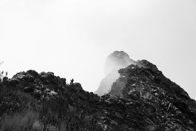 Low angle view of mountain against clear sky