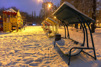 Empty playground on field during winter