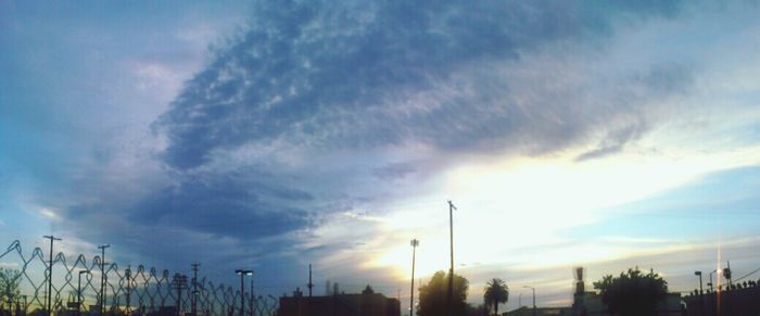 Low angle view of cloudy sky at sunset