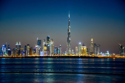 Illuminated buildings in city at night