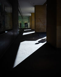 Sunlight falling on empty corridor in building