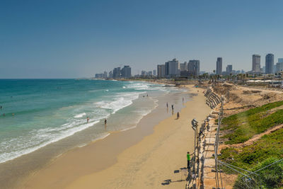 Panoramic view of sea and buildings against clear sky