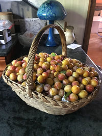 High angle view of fruits in basket on table