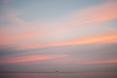 Scenic view of sea against orange sky