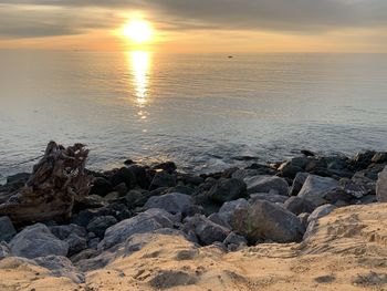 Scenic view of sea against sky during sunset