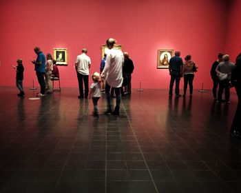 People standing on tiled floor