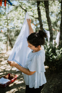 Close-up of woman standing on tree