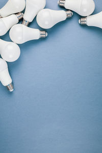 Low section of woman on table against blue background