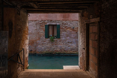 Venice canal house window seen through door